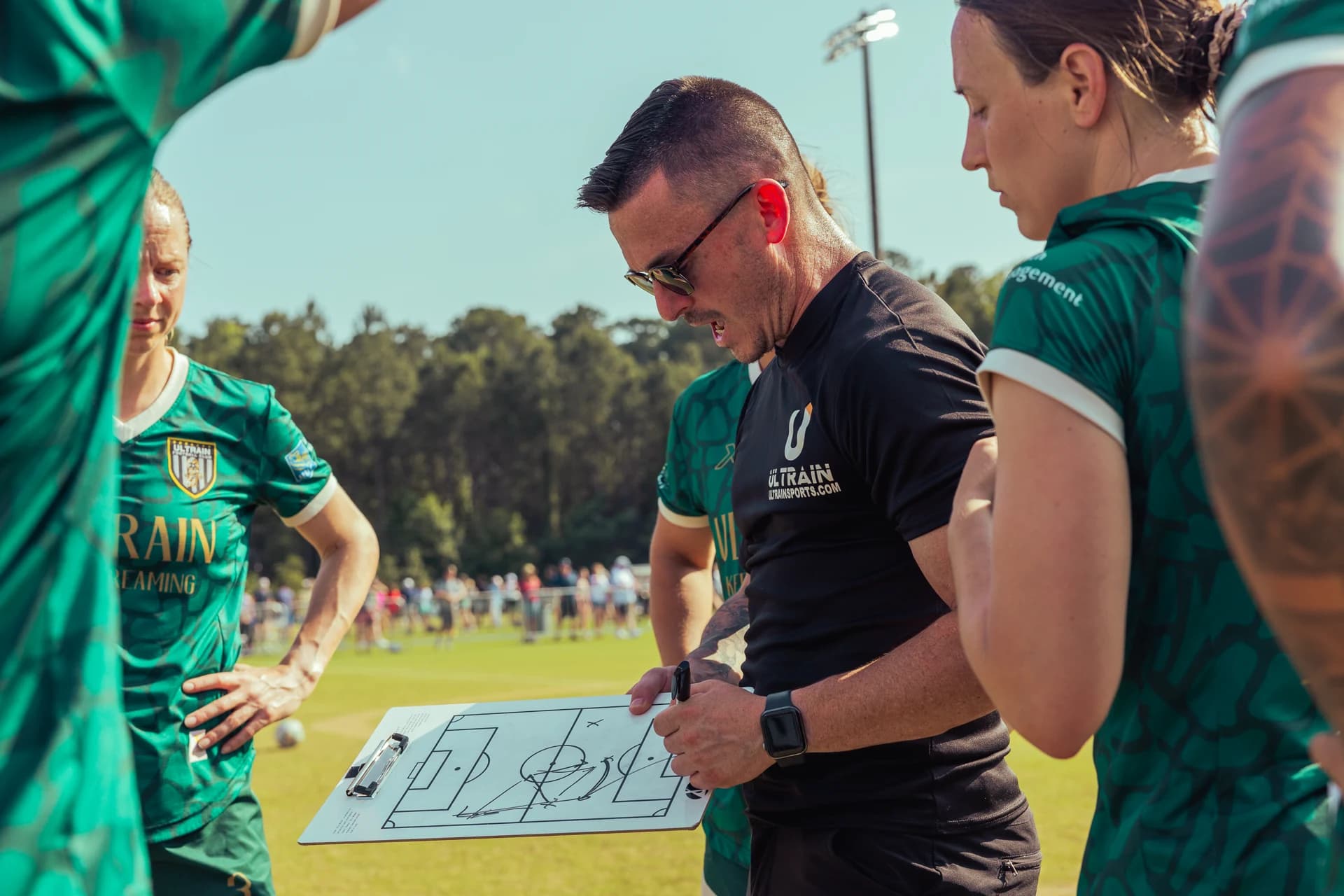 ULTRAIN coach working through a game plan with the team